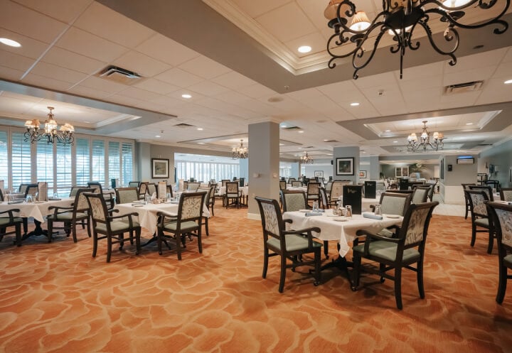Elegant Dining Room with Multiple Tables at Assisted Living Facility Elegant Dining Room with Multiple Tables at Assisted Living Facility