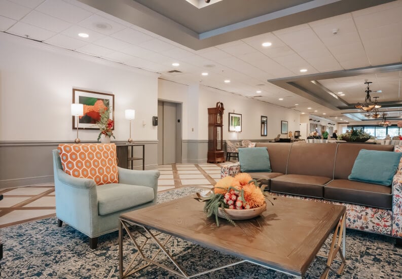 Spacious Common Area Lounge with Modern Furniture at Independent Living Facility Spacious Common Area Lounge with Modern Furniture at Independent Living Facility