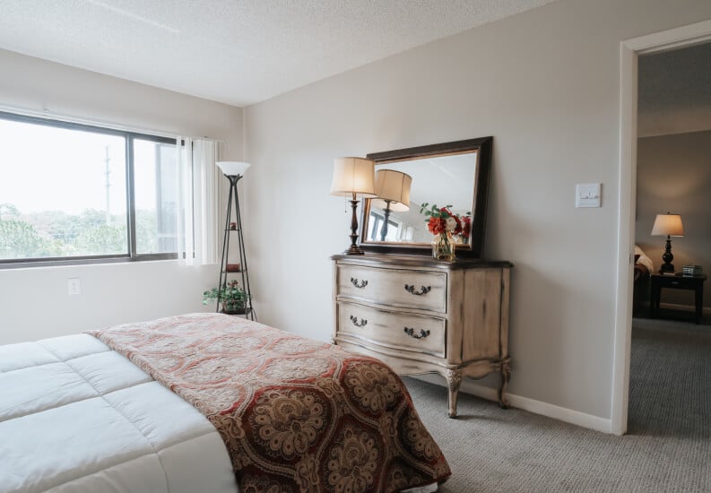Bright Bedroom with Window and Dresser at Assisted Living Facility Bright Bedroom with Window and Dresser at Assisted Living Facility